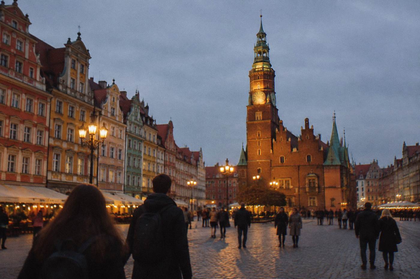 Wroclaw market square buildings and the illuminated town hall tower seen after dark