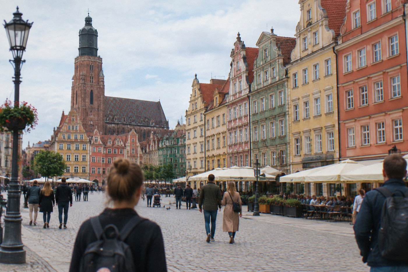 Historic townhouses lining the Wroclaw market square on a bright day