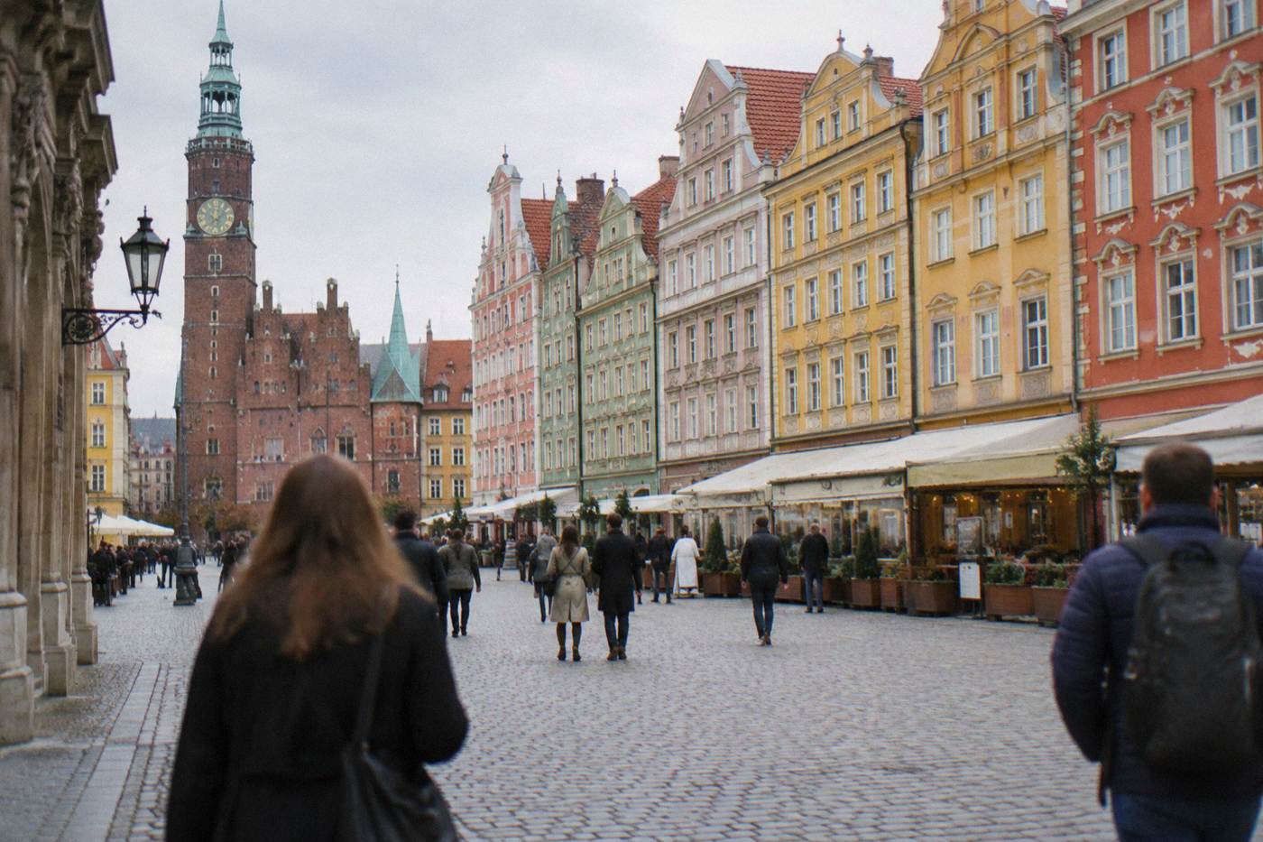 Colorful facades of merchant houses lining the Market Square in Old Town Wroclaw on a bright day