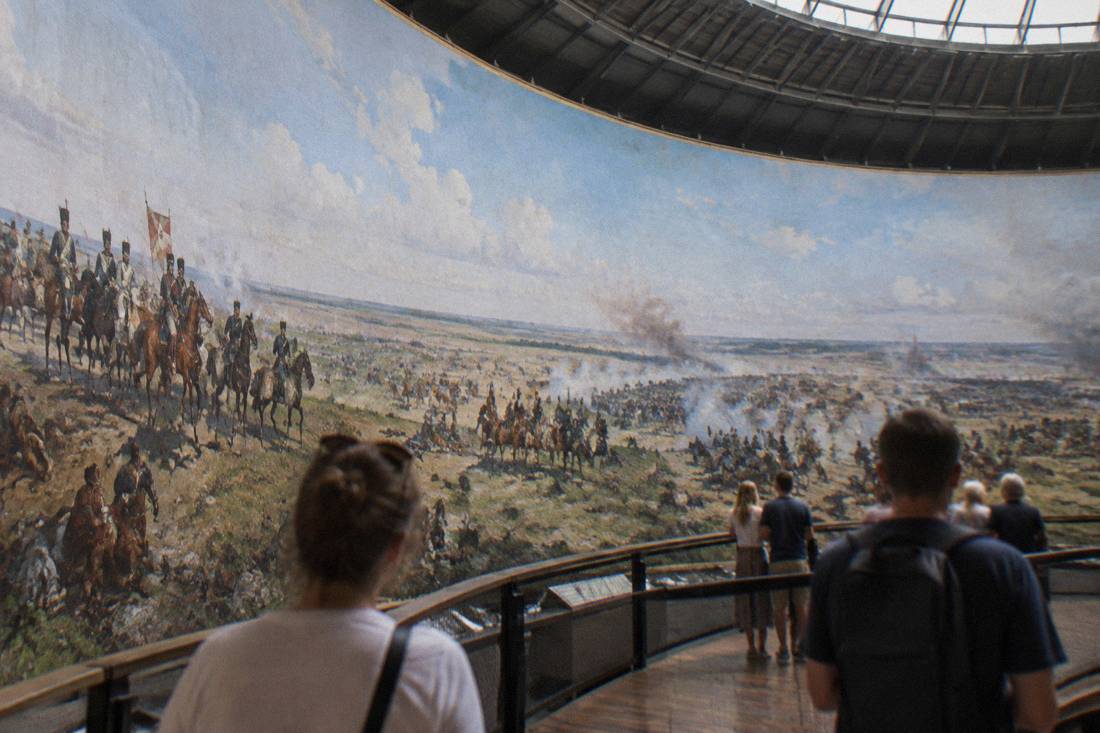 The painted interior rotunda of the Panorama Raclawicka with a cylindrical battlefield painting wrapping the viewing platform