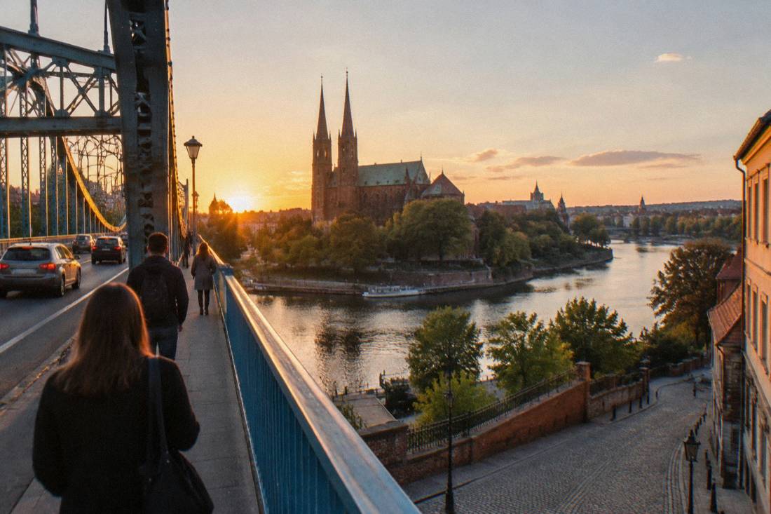 Narrow cobbled streets and a gothic cathedral on a river island at golden hour