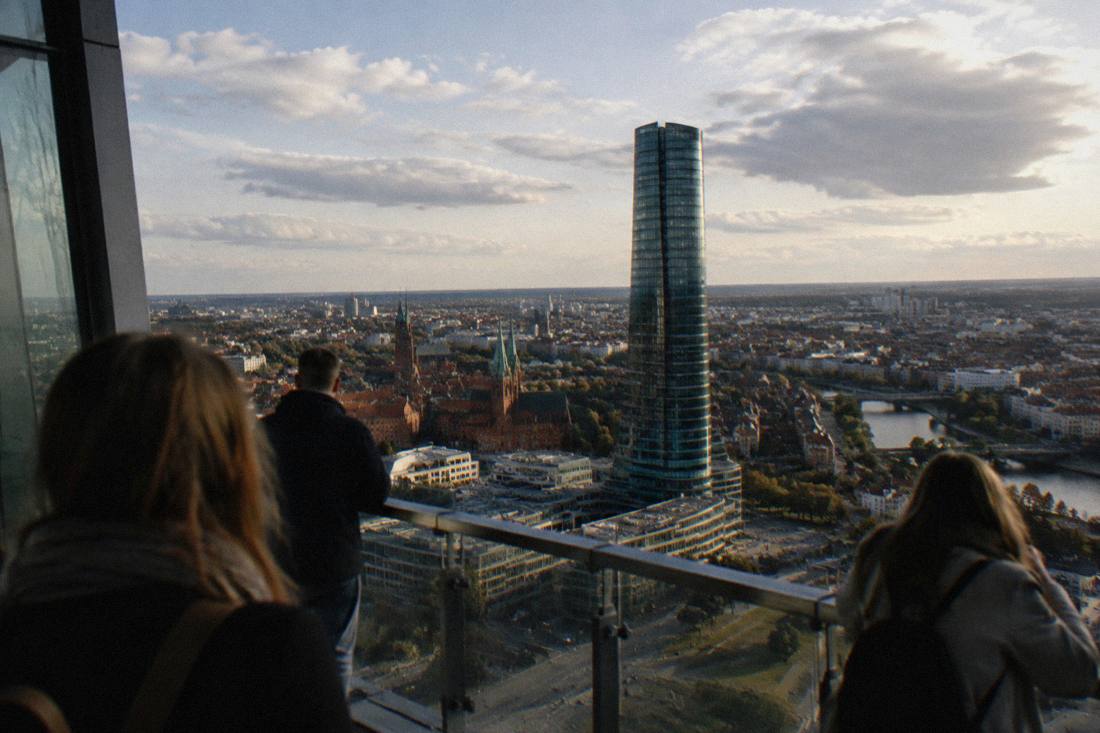 The skyscraper under a partly cloudy sky above the city center