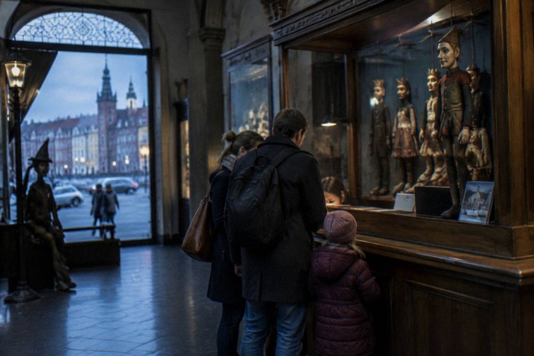 A family buying tickets at a museum counter in Wroclaw