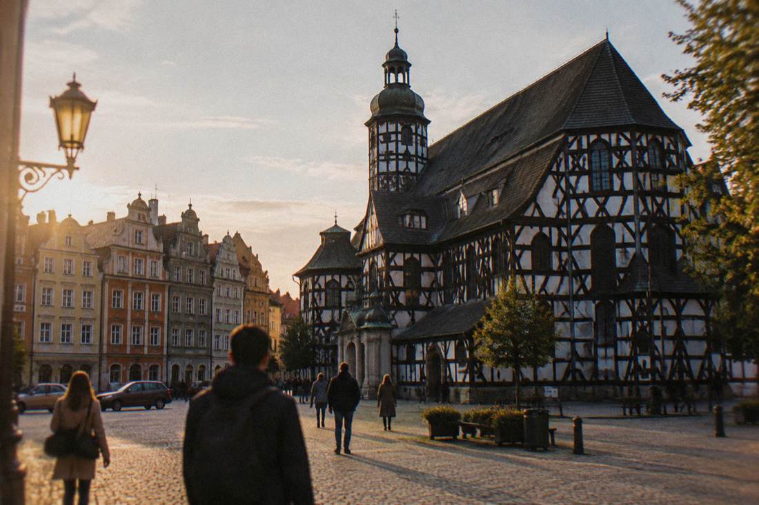 The town square of Swidnica with historic townhouses near the Church of Peace