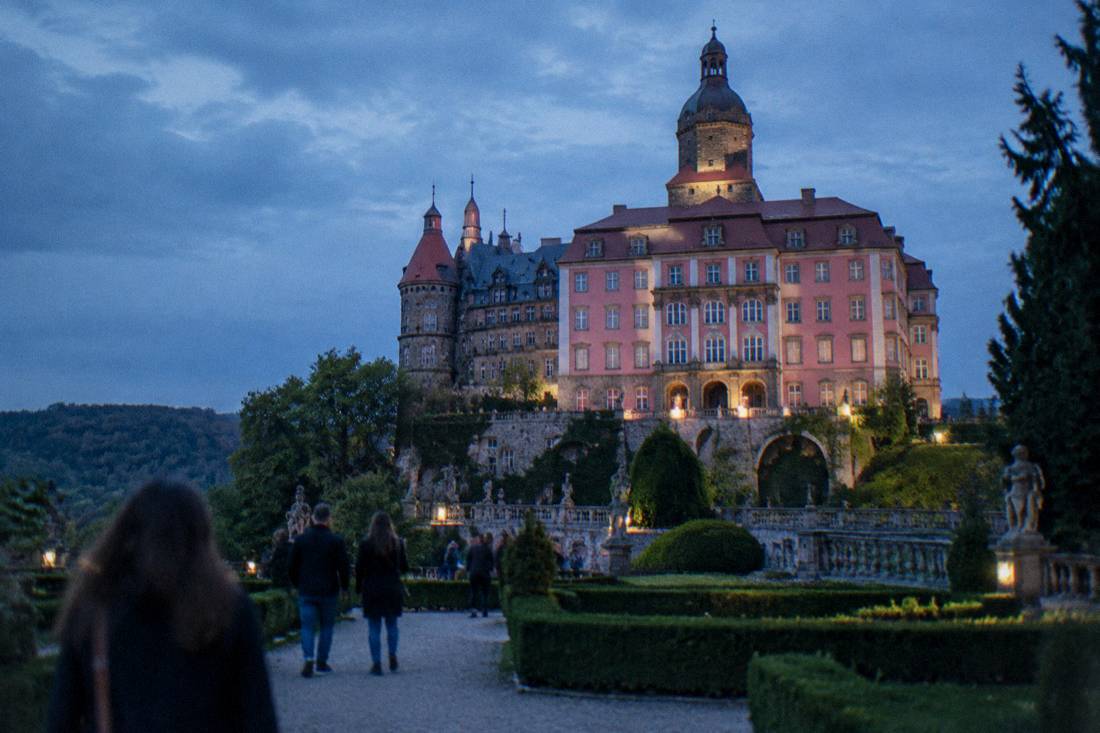The grand facade and terraces of Ksiaz Castle seen from its gardens