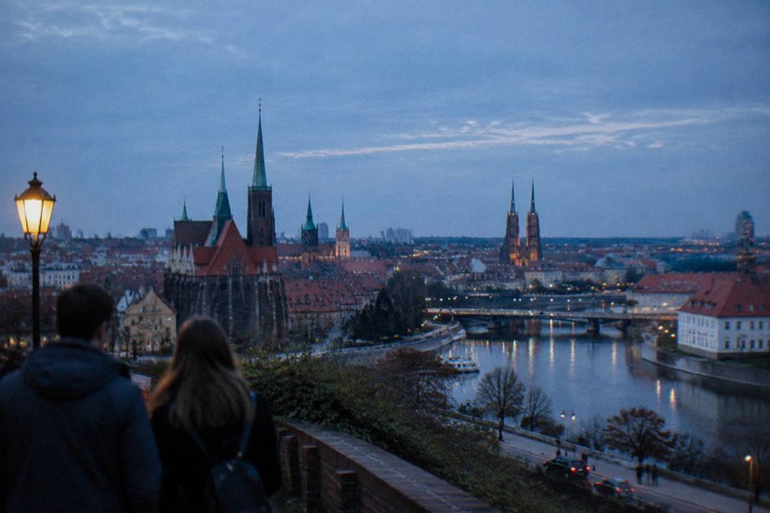 The spired rooftops of Prague's Lesser Town seen from the castle hill above the river