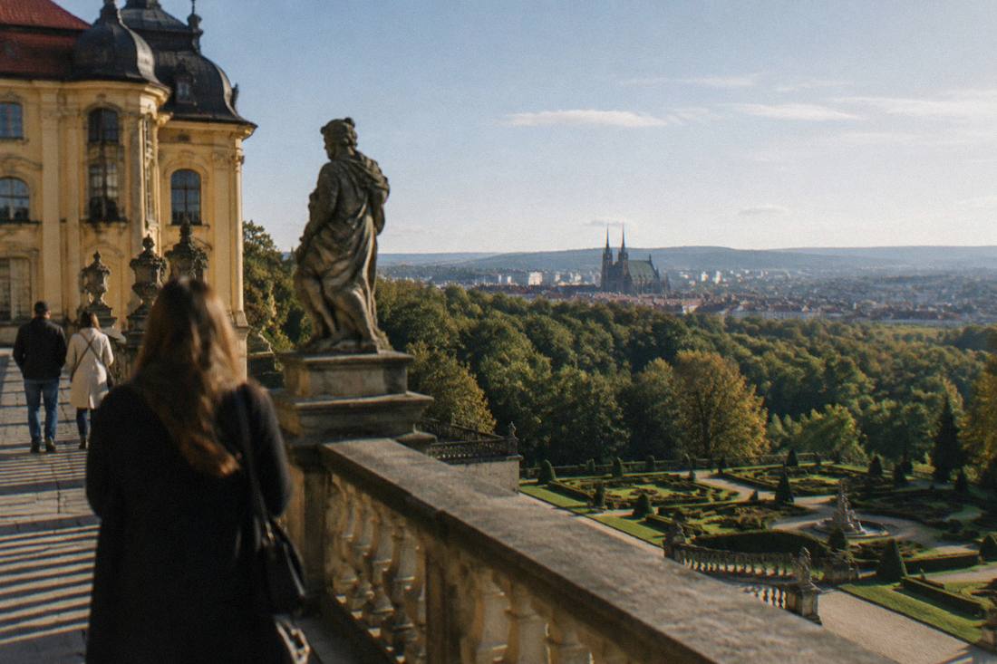 A baroque castle terrace above gardens and forest in Lower Silesia on a clear day