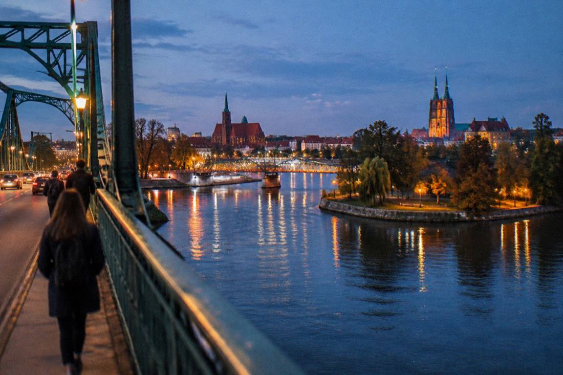 Blue hour over Wroclaw with lit bridges crossing the Odra river