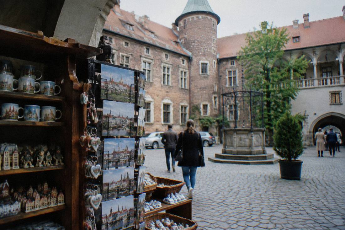 A gift shop display inside a historic Silesian castle courtyard