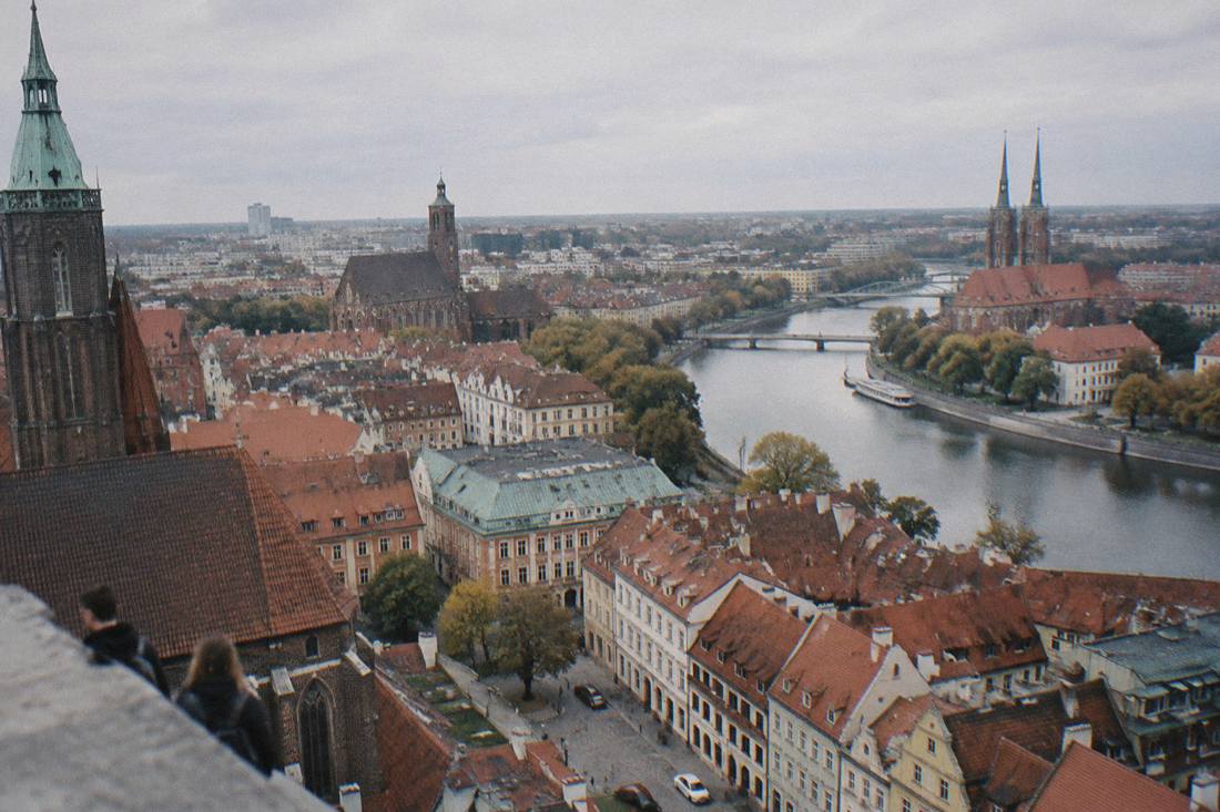 Aerial view of Wroclaw Old Town rooftops with the Odra river winding past church towers