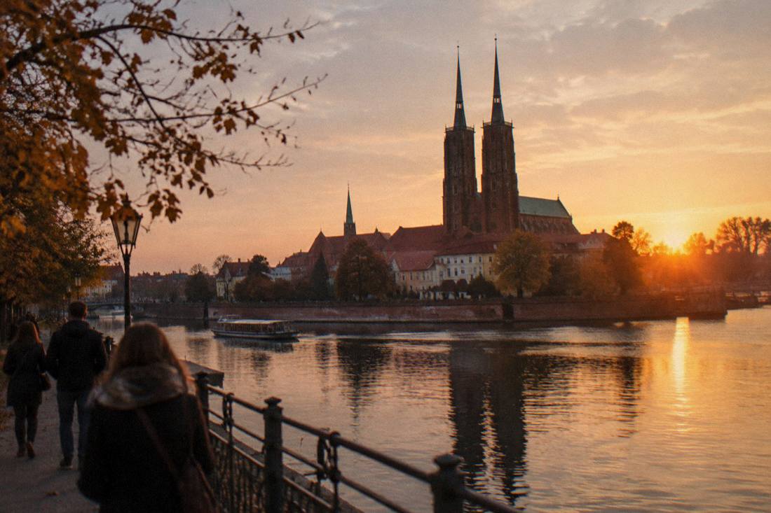 Sunset over the Odra river with Wroclaw Cathedral towers silhouetted on Cathedral Island