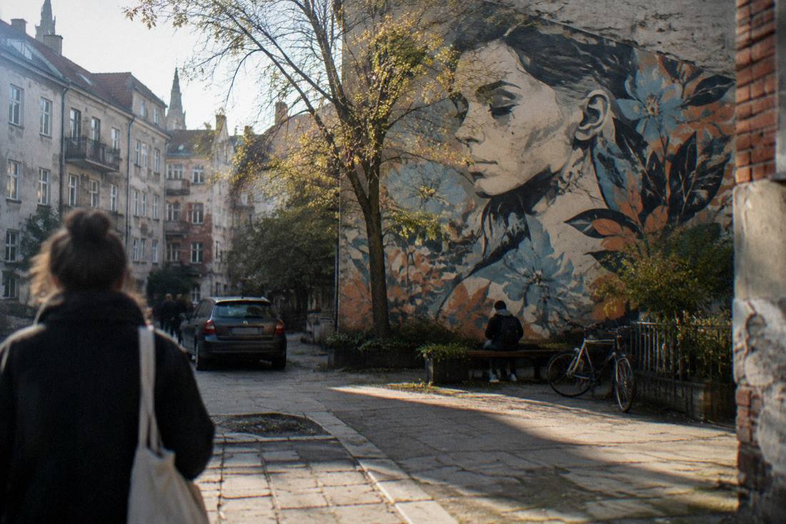 A mural-covered courtyard wall in the Nadodrze district of Wroclaw