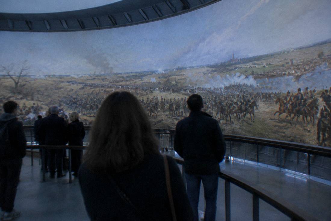 Visitors viewing a large cylindrical panoramic painting inside the Panorama Raclawicka rotunda in Wroclaw