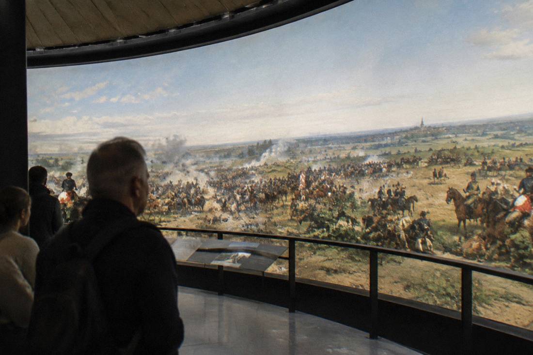 Visitors viewing the Panorama Raclawicka painting inside the rotunda in Wroclaw