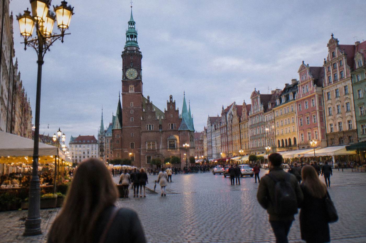 Evening view over Wroclaw's market square with the town hall tower and pastel townhouses