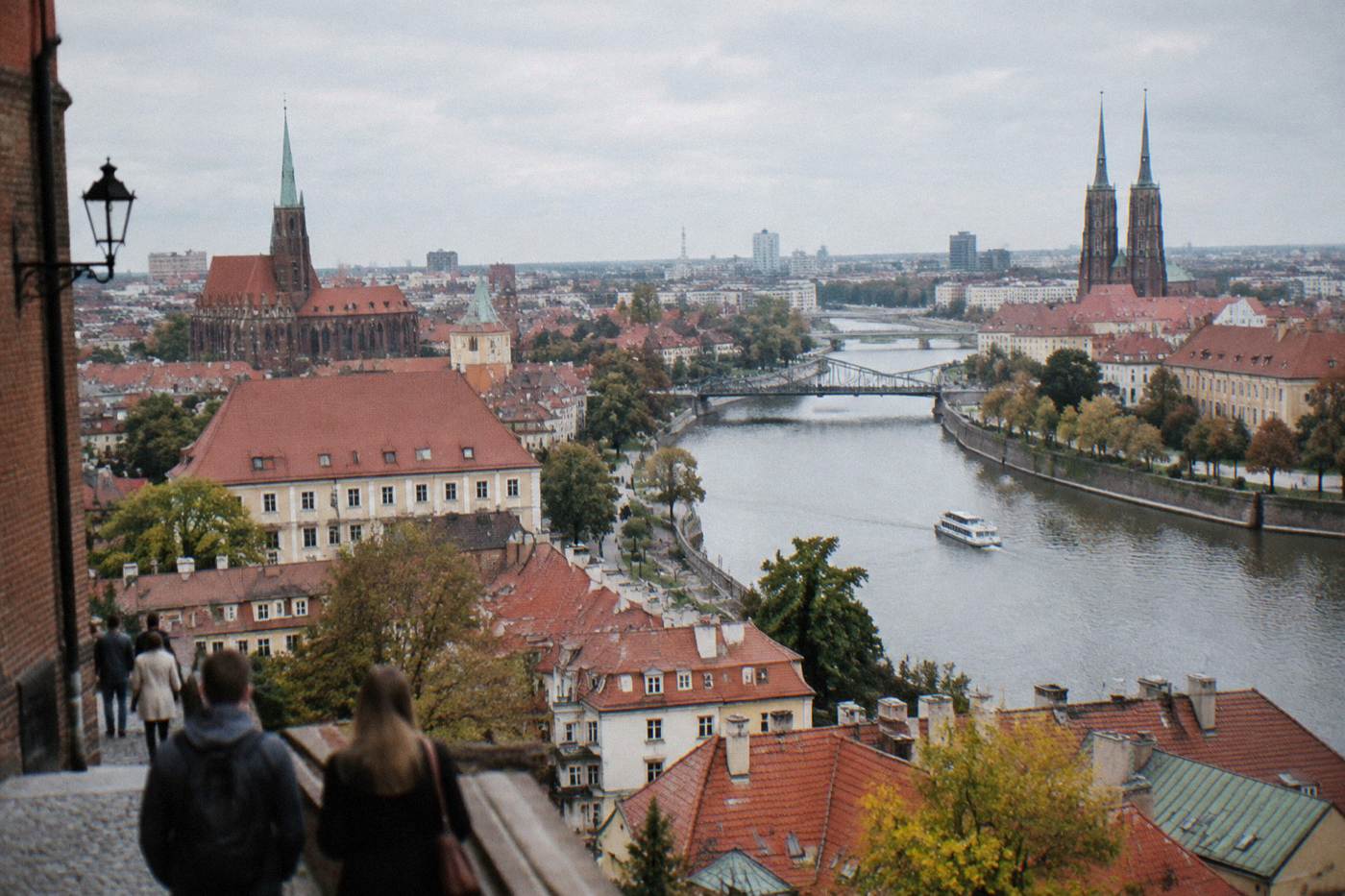 Panoramic view over Wroclaw's Old Town rooftops with the Odra river winding through the city