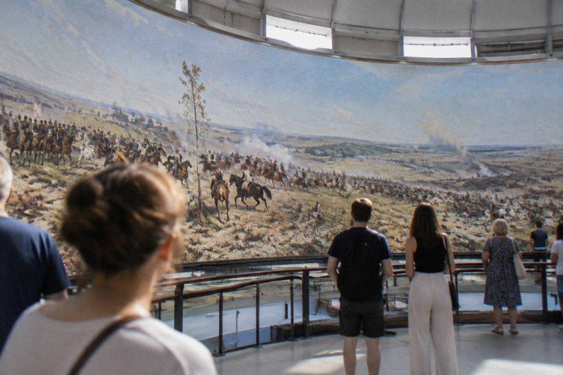 Visitors viewing the circular Panorama Raclawicka painting inside the rotunda in Wroclaw