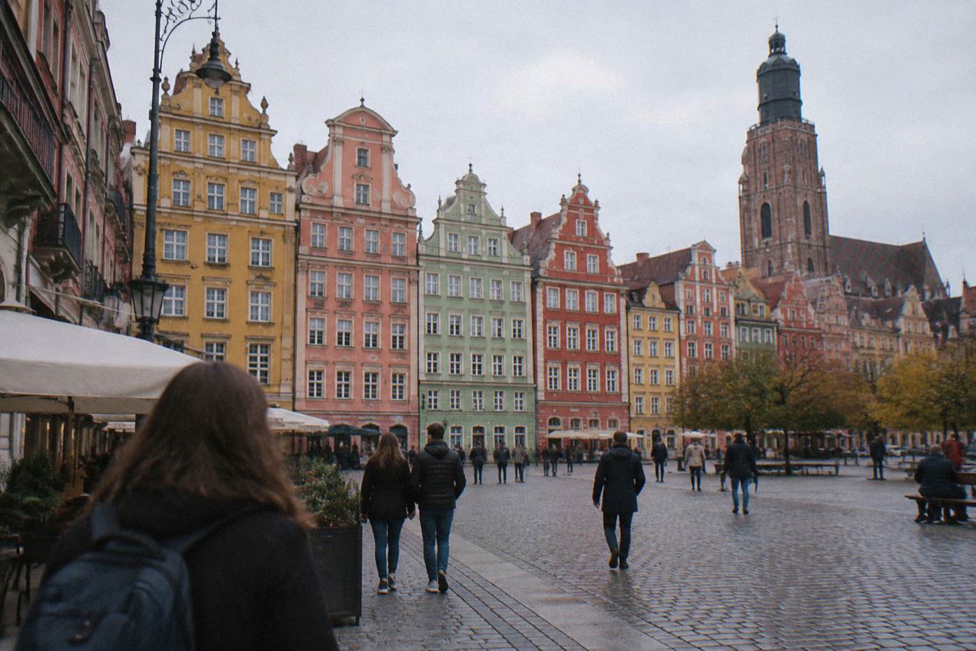 The colorful painted townhouses of the Wroclaw market square seen from ground level
