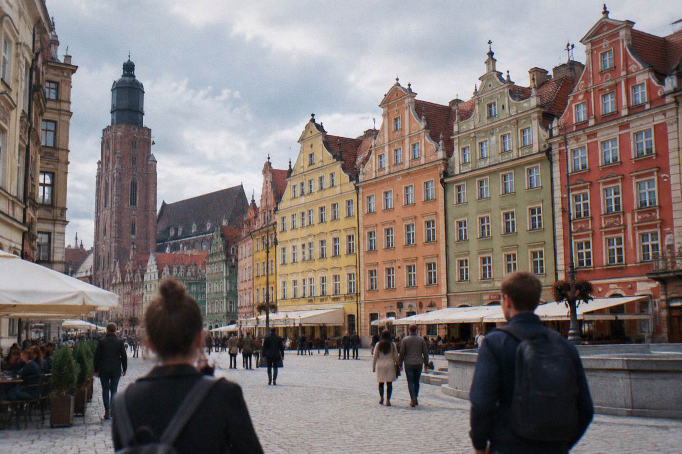 The colorful painted townhouses of Wroclaw Market Square seen from the ground on a bright day
