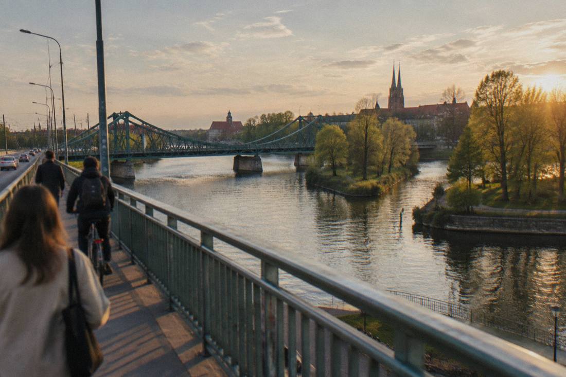 Odra river in Wroclaw in spring with trees beginning to leaf along the bank