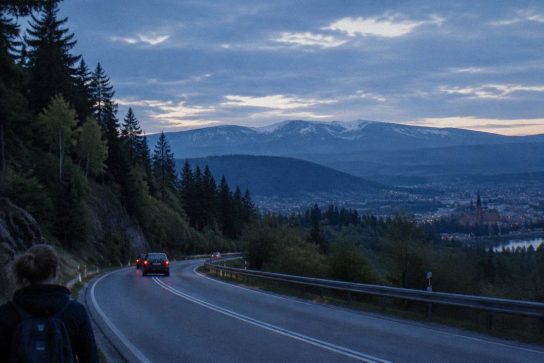 A winding road through forested hills toward the Giant Mountains in Lower Silesia, Poland