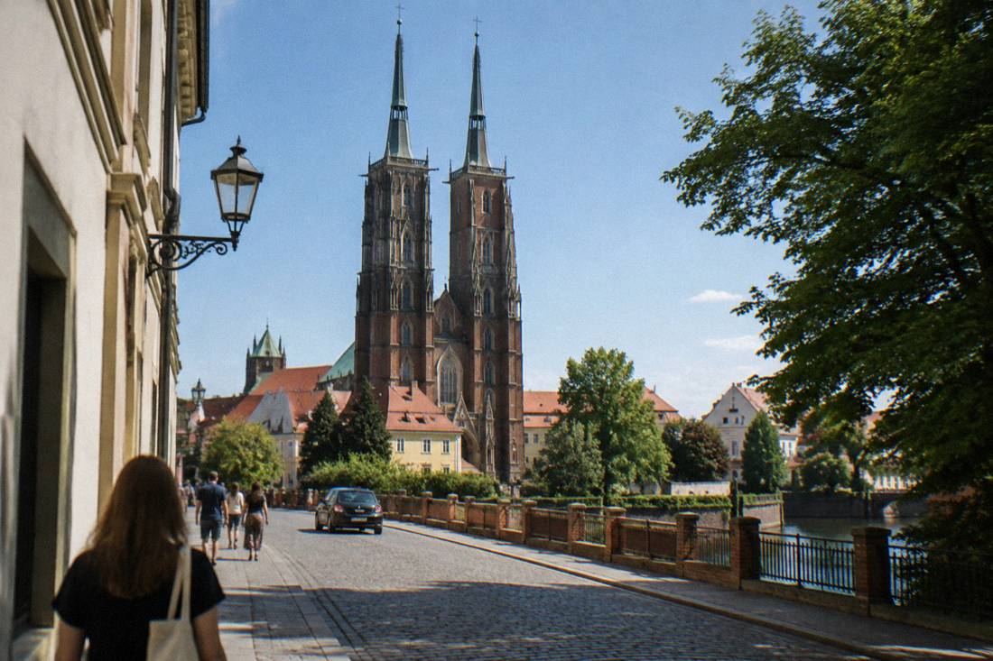 Gothic cathedral towers above cobblestone streets on Ostrow Tumski island in Wroclaw